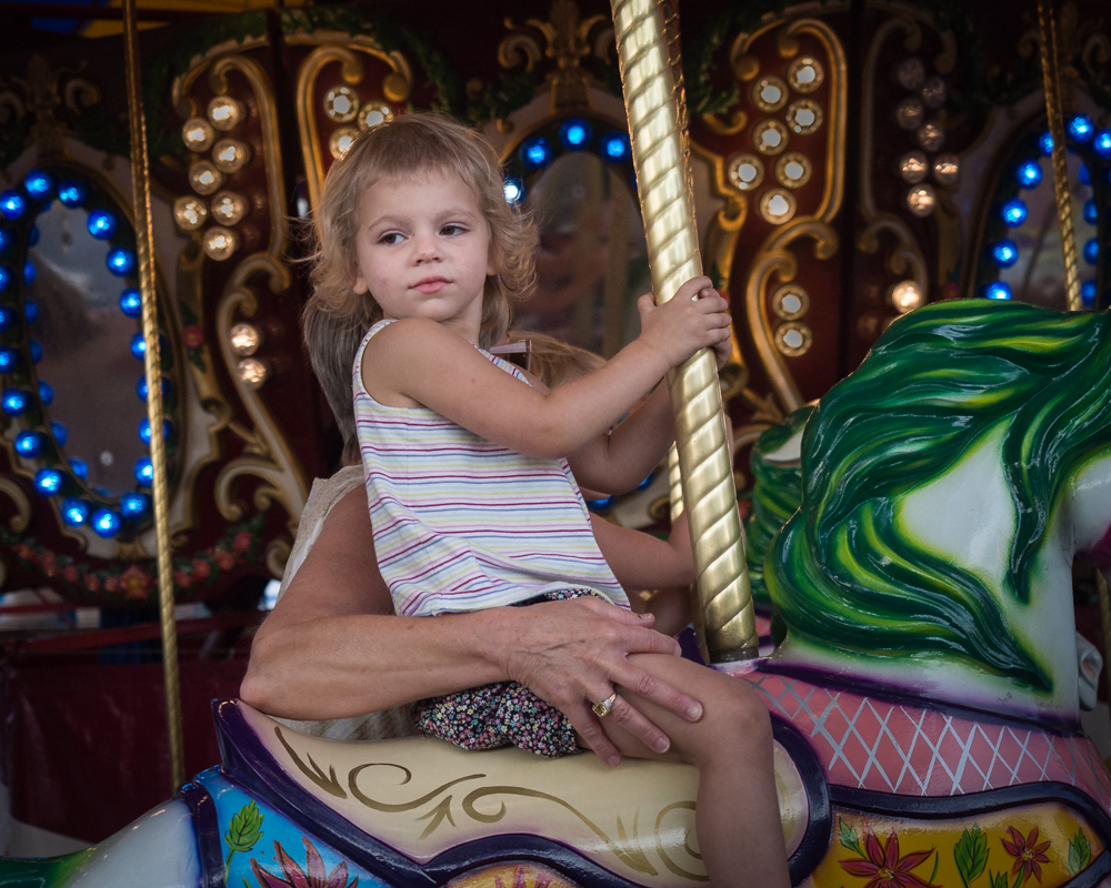 Girl on a Merry Go Round - Color Print - Rick Riddle